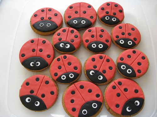 there are many decorated cookies in the shape of ladybugs