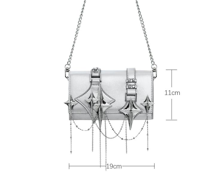 High-Quality Materials: This handbag is meticulously crafted with an exquisite combination of 18K platinum plating and high-end leather, ensuring both durability and a sophisticated appearance. The premium materials used provide a luxurious finish, setting it apart in terms of quality and elegance. Size Details: Measuring 19cm in length and 11cm in height, the Star Trails Chain Handbag Satchel™ offers a compact yet spacious interior, perfect for carrying your essentials. Its versatile size makes it suitable for various occasions, from casual outings to formal events. Novel Design: What truly makes this handbag unique is its distinctive four-pointed star embellishments, adding a touch of individuality and flair. The elegant chain detail further enhances its chic look, making it a stylish ac High-end Silver Rectangular Shoulder Bag, Silver Rectangular Evening Bag With Chain Strap, Trendy Metallic Shoulder Bag For Formal Occasions, Metallic Chain Bag For Party, Designer Silver Shoulder Bag Gift, Designer Silver Shoulder Bag As Gift, Modern Formal Shoulder Bag With Chain Detail, Modern Formal Shoulder Bag With Chain, Metallic Rectangular Shoulder Bag With Chain Strap