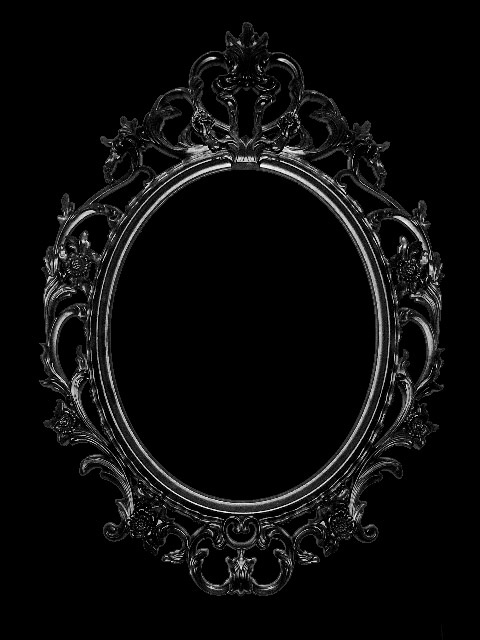 a black and white photo of an ornate frame