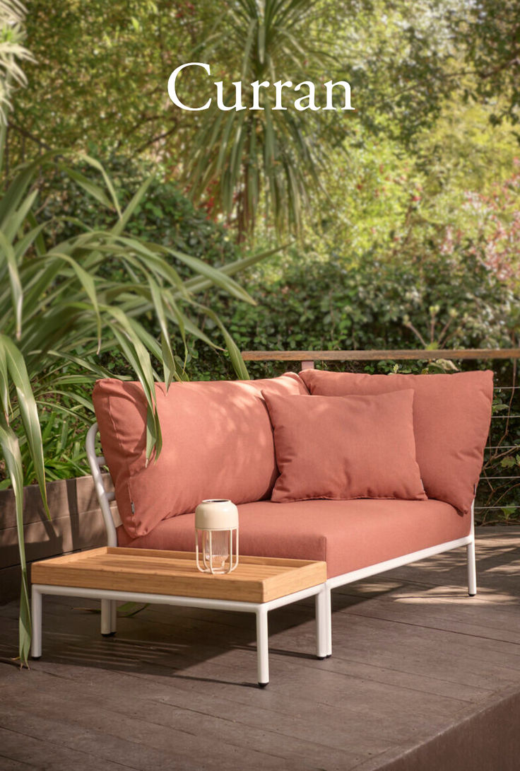 a couch sitting on top of a wooden table