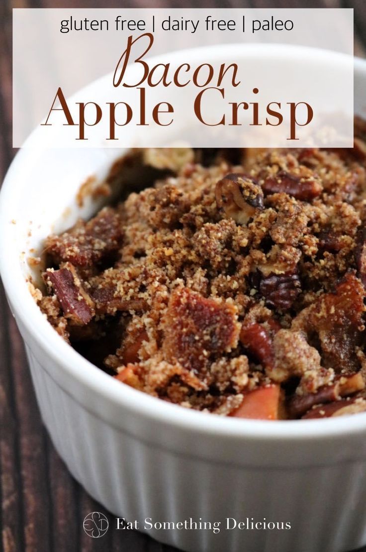 an apple crisp in a white bowl on a wooden table with text that reads gluten free, dairy - free paleo bacon apple crisp