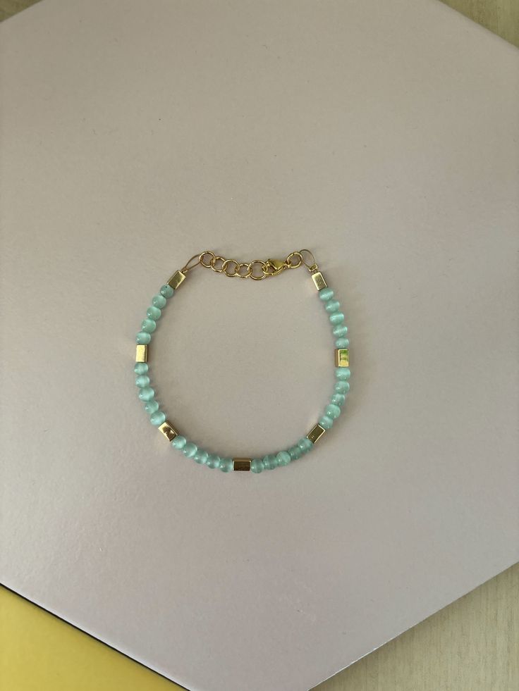 This bracelet is handmade from glass beads, gold hematite beads and finished with gold plated findings. This design is inspired by Kiera. The beaded portion of the bracelet is ~6 inches with a chain extending ~8.75 inches. Size may vary slightly due to bead patterns. If you would like a custom size, please specify in the customization prompt. Gold Beaded Chain Friendship Bracelets As Gift, Adjustable Gold Beaded Chain Friendship Bracelets, Adjustable Gold Beaded Chain Rosary Bracelet, Adjustable Gold Beaded Rosary Bracelet, Heishi Beaded Chain Bracelet Jewelry, Gold Heishi Beads Beaded Bracelets Gift, Heishi Bead Bracelet With Beaded Chain, Gold Heishi Beads Friendship Bracelet, Adjustable Beaded Gold Bracelet As Gift