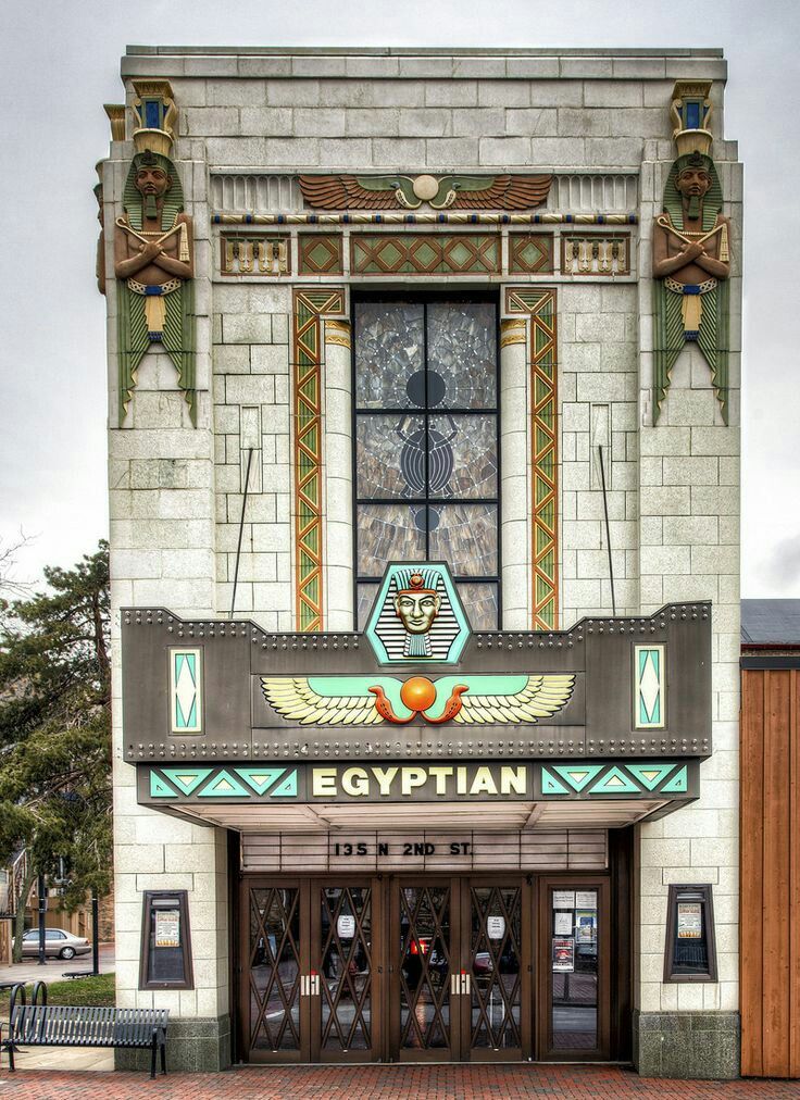 the egyptian theater is located in an old brick building with stained glass windows and doors