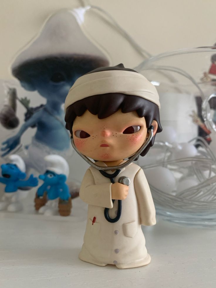 a small figurine with a doctor's hat on