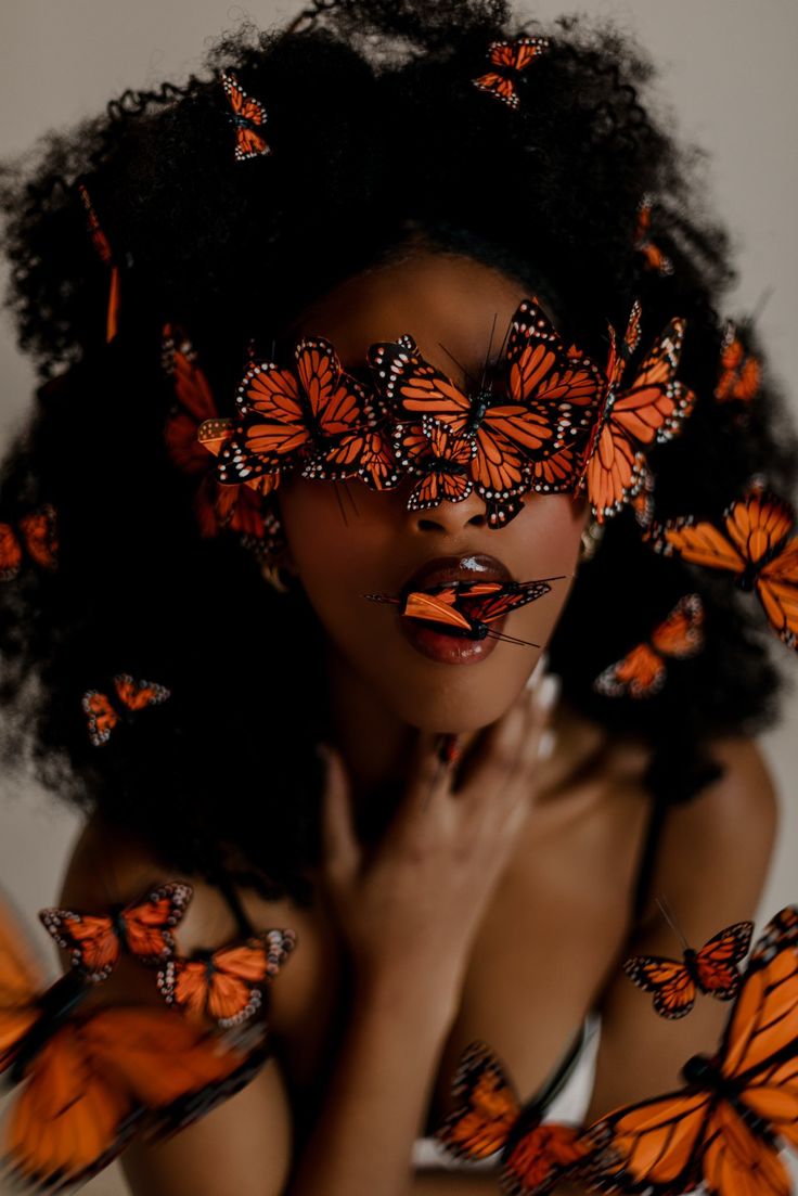 a woman with many butterflies on her face