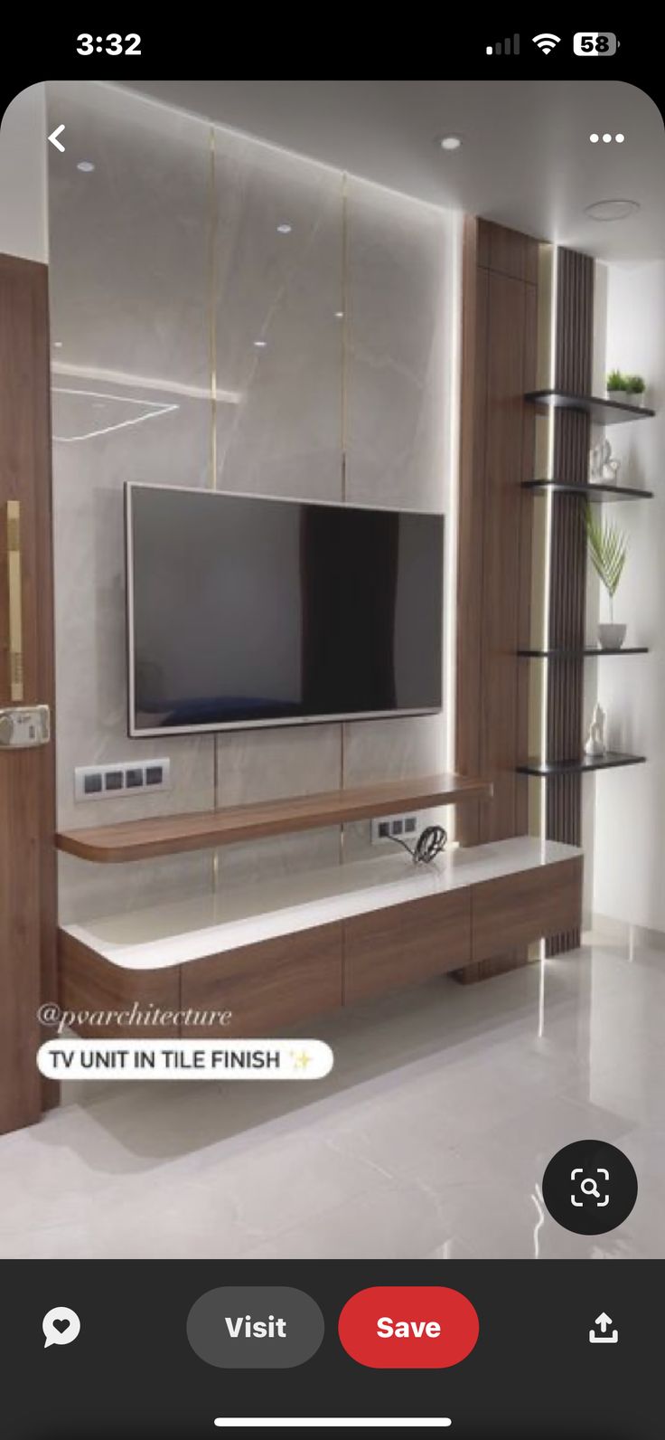 a flat screen tv sitting on top of a wooden entertainment center