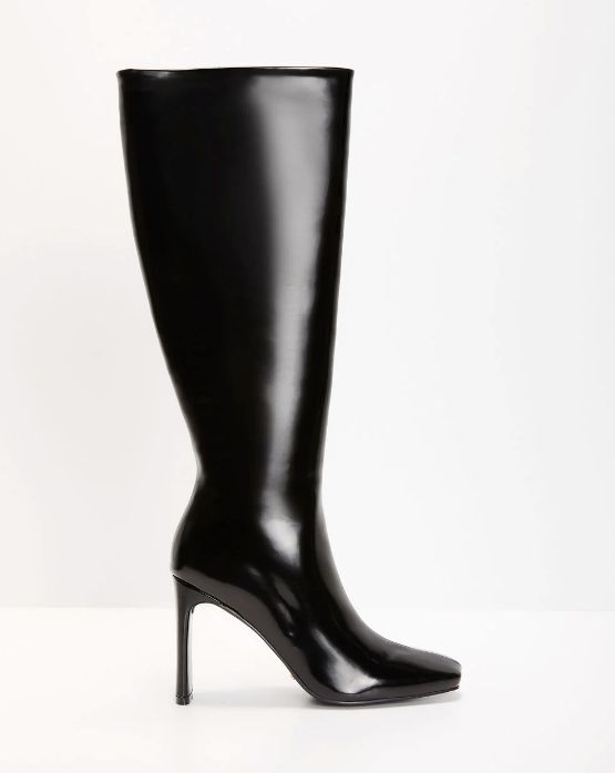 These high heeled boots sit right below the knee and offer a classy and elegant look, perfect for dressing up any outfit. 3.9" heel Closed pointed square toe Full zipper side closure Material: 100% Synthetic upper and lining, 100% Rubber outersole Elegant Tall Heeled Boots For Workwear, Elegant Tall Heeled Boots For Work, Chic Tall Mid-calf Boots For Formal Occasions, Sleek Fitted High Heel Boots, Sleek Wide Calf Mid-calf Boots, Tall Sleek Knee-high Boots For Evening, Sleek Wide Calf Heeled Boots With Reinforced Heel, Sleek Boots With 4-inch Heel For Night Out, Sleek Heeled Boots With 4-inch Heel For Formal Occasions