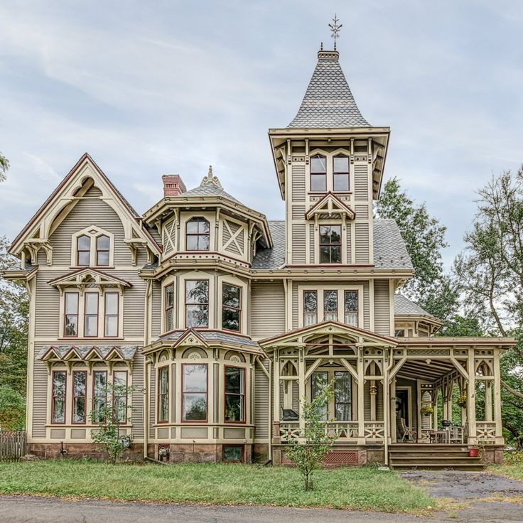 an old victorian style house in the country