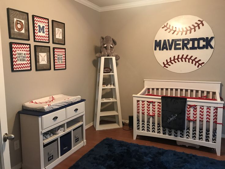 a baby's room with baseball themed decor