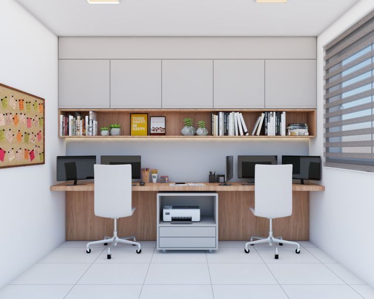 an office with two computer desks and white chairs