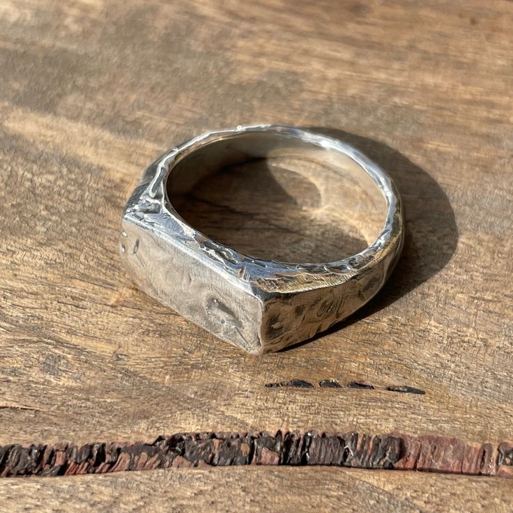 This beautifully textured, rugged version of our Small Rectangle Signet Ring is ready for anything life throws at it. The face of this signet is a perfect blank canvas upon which to add your personal touch, designed to accomodate up to three hand-stamped letters or numbers. These timeless signet rings are meticulously crafted by hand in our Melbourne workshop, created out of wax and then cast into precious metal. Made with the highest quality Australian sterling silver to last forever. Made soli Men Signet Ring Silver, Silver Signet Ring Mens, Diy Silver Rings, Silver Rings Men, Wax Carved Ring, Rectangle Signet Ring, Cowboy Jewelry, Silver Ring Men, Jewelry Making Workshop