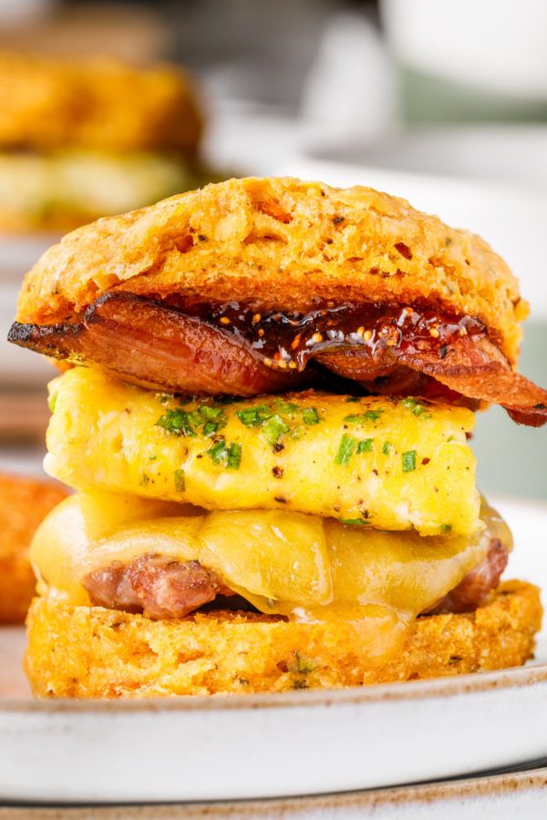 a breakfast sandwich with bacon, egg and cheese