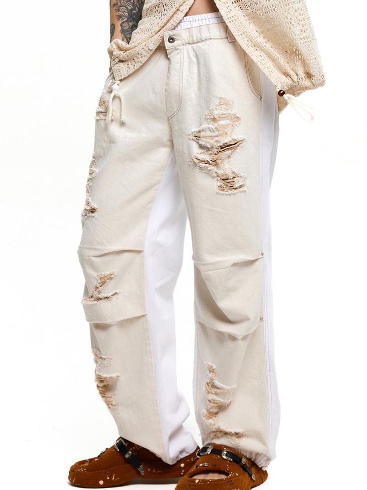 This is a casual and comfortable denim pants that are made out of high quality cotton 100% denim fabric. With design detail of straight silhouette, pin tuck detail on the knee, and adjustable string and stopper on the hem, it gives a comfortable and trendy mood.- Sand and bio washed fabric- Elastic waistband- Relaxed straight silhouette- Adjustable string and stopper on the hem Ripped Baggy Cotton Cargo Jeans, Baggy Ripped Cotton Cargo Jeans, Casual Wide Leg Deconstructed Bottoms, Spring Distressed Cotton Cargo Jeans, Casual Deconstructed Bottoms For Streetwear, Wide Leg Deconstructed Cotton Jeans, Casual Deconstructed Jeans For Spring, Streetwear Cotton Pants With Frayed Hem, Baggy Cotton Pants With Frayed Hem