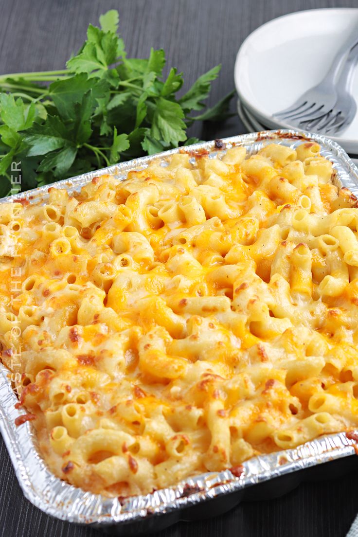 a casserole dish with macaroni and cheese in it on a table