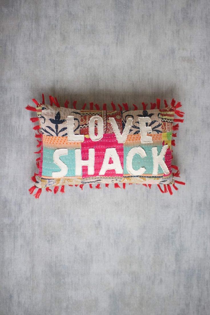 a decorative pillow that says love shack on it