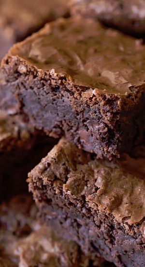 chocolate brownies stacked on top of each other