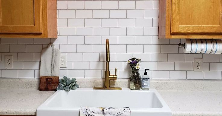 the kitchen sink is clean and ready for us to use it's faucet