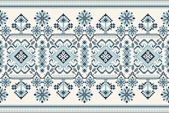 a blue and white cross stitch pattern with snowflakes on the border, as well as