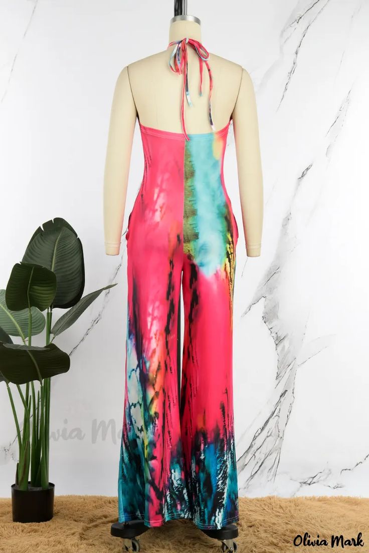 Olivia Mark - Stylish Multicolor Casual Print Backless Halter Jumpsuits with a Touch of Elegance Summer Stretch Pink Jumpsuits And Rompers, Sleeveless Multicolor Bodysuit For Festivals, Multicolor Sleeveless Bodysuit For Festivals, Fitted Green Jumpsuits For Beach Season, Fitted Green Jumpsuits And Rompers For Beach Season, Multicolor Stretch Halter Neck Bodysuit, Spring Multicolor Backless Jumpsuits And Rompers, Multicolor Backless Bodysuit For Party, Pink Fitted Halter Neck Jumpsuit