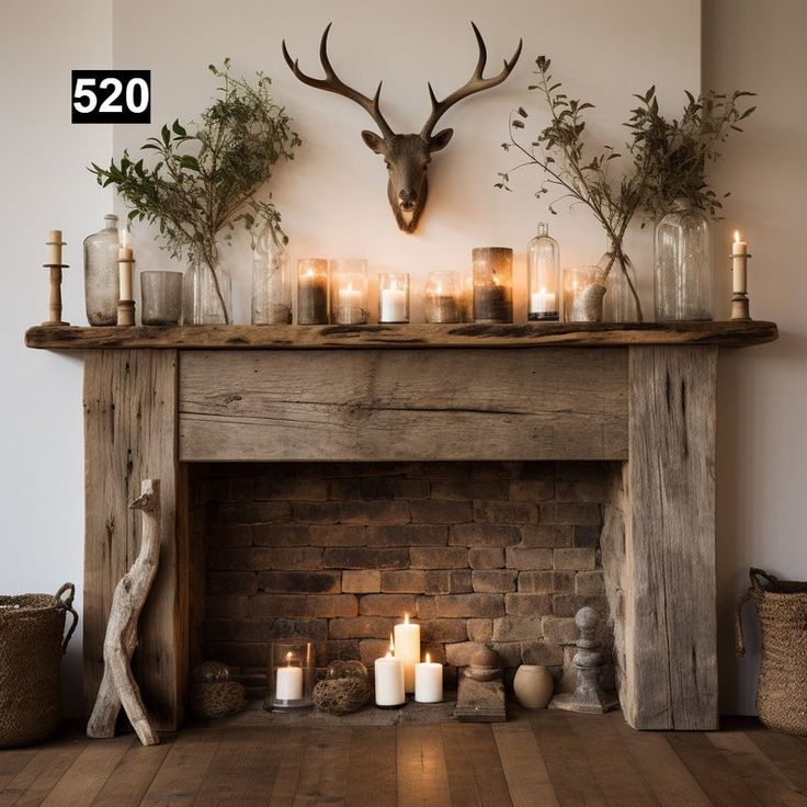 a fireplace with candles and deer heads on the mantle