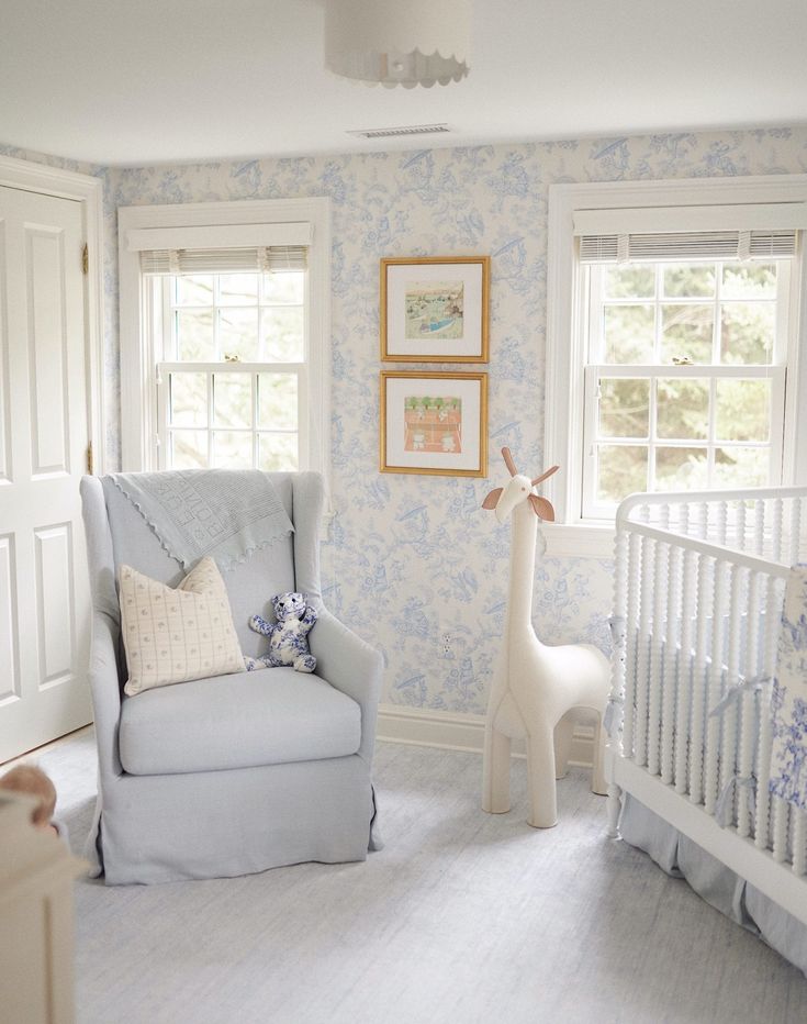 a baby's room is decorated in white and pink