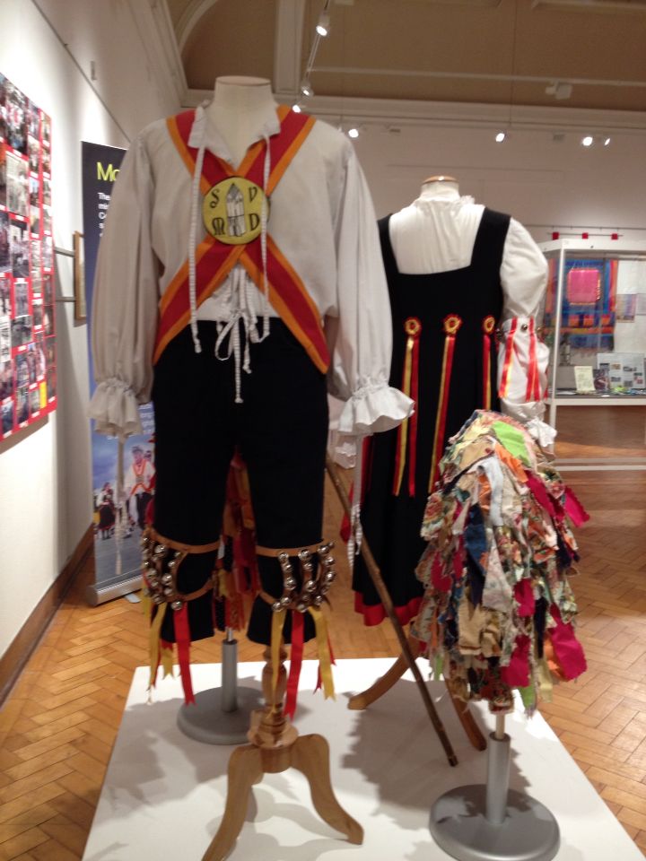 two mannequins dressed in pirate costumes on display