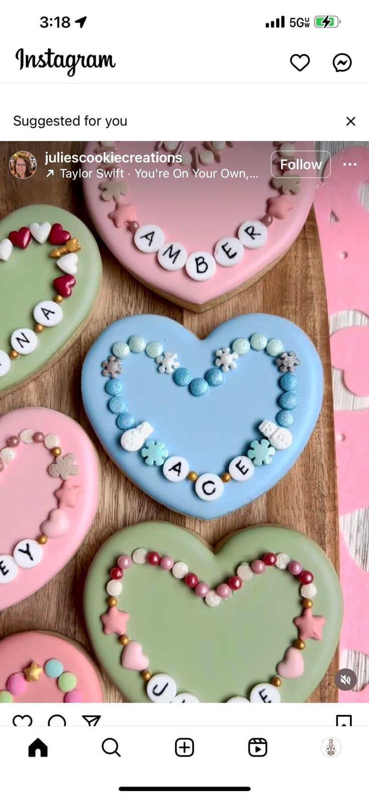 some cookies that are on top of a wooden table with the words i love you spelled in