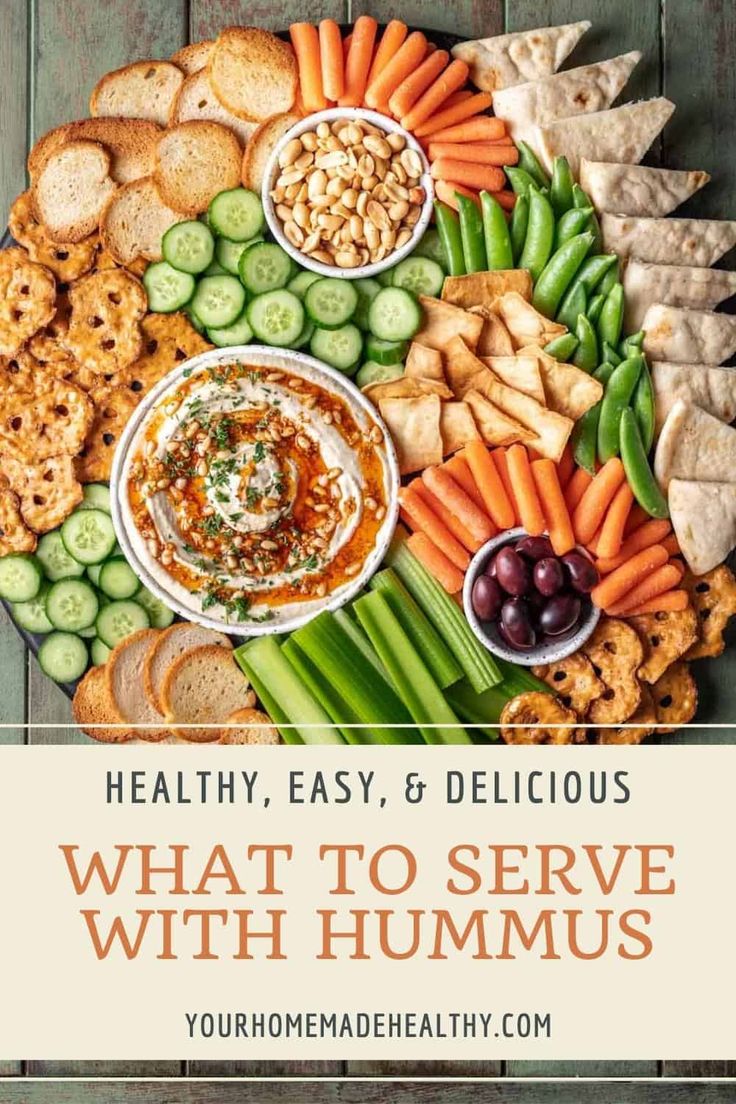 a platter filled with different types of food and the words healthy, easy & delicious what to serve with hummus