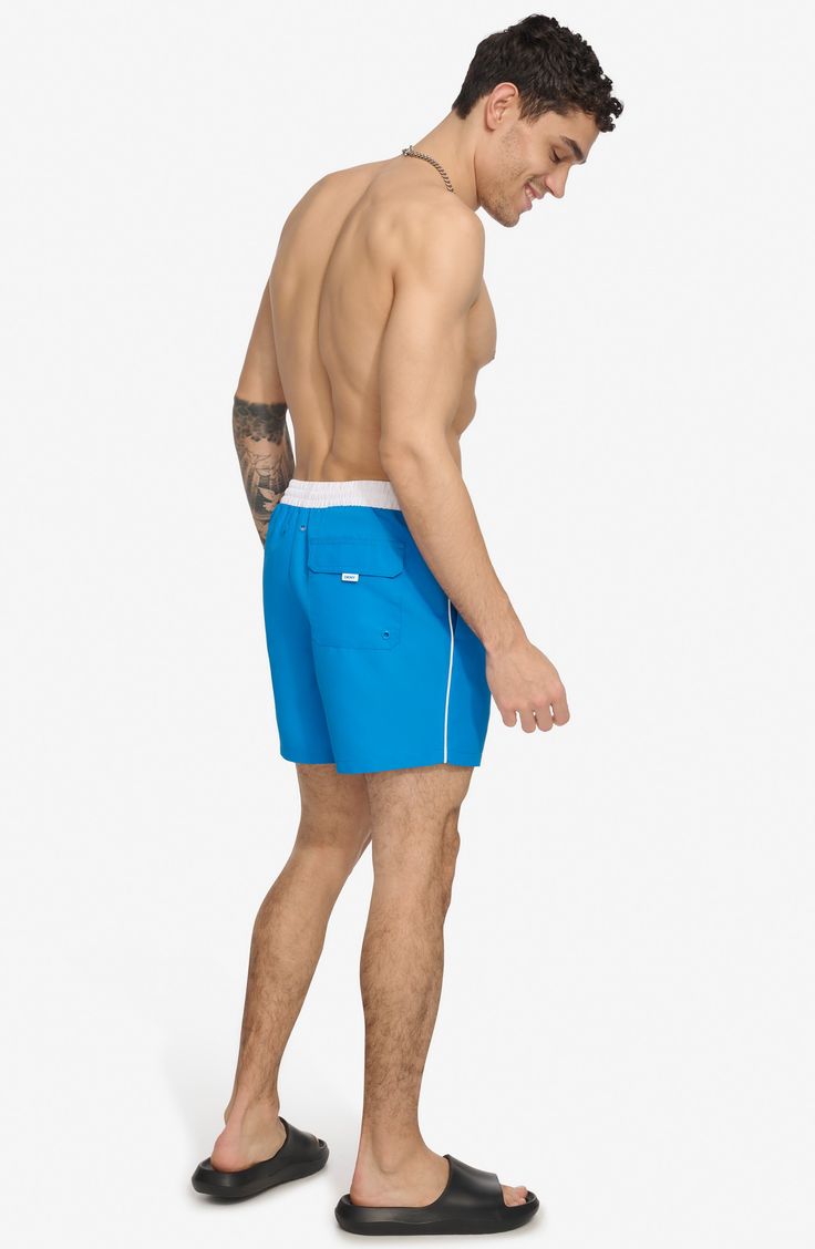 Soak up the sun in these recycled-fiber swim trunks built with quick-drying properties and UPF 40+ sun protection. 5" inseam (size Medium) Elastic/drawstring waist Front slant pockets; back patch pocket Lined 100% REPREVE polyester REPREVE recycled polyester is made from 100% post-consumer recycled plastic bottles Machine wash, tumble dry Imported Soak Up The Sun, Concert Looks, Sports Blazer, Short Suit, Jogger Jeans, Suit Shop, Jogger Sweatpants, Denim Jumpsuit, Casual Streetwear