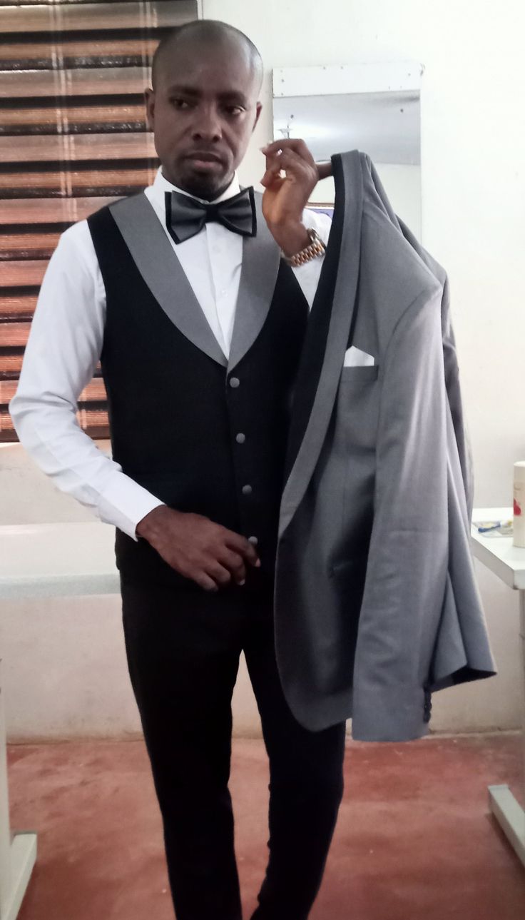 This unique wedding suit is designed with high quality wool material that guarantees durability and comfort. It is suitable for all kinds of occasion and it can be worn all year round. It comes in 3 pieces (Grey Jacket designed with black collar/ lapel + black Vest + black pant), For custom orders, Please feel free to start a  conversation for further enquires. Your satisfaction is our priority  I hope you have a pleasurable shopping experience Tailored Gray Tuxedo Blazer, Gray Tuxedo Blazer With Notch Lapel, Tailored Gray Tuxedo In Suiting Fabric, Gray Tuxedo Suit For Formal Occasions, Fitted Gray Tuxedo For Semi-formal Occasions, Tailored Gray Tuxedo For Formal Occasions, Semi-formal Gray Tuxedo With Notch Lapel, Gray Notch Lapel Tuxedo For Semi-formal Events, Gray Notch Lapel Tuxedo For Semi-formal Occasions