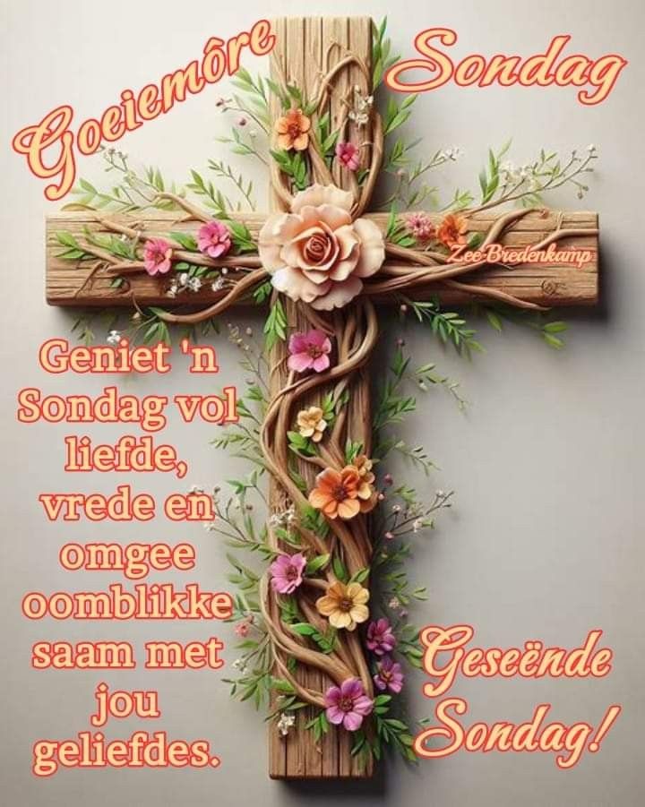 a wooden cross with flowers on it and the words golemore sondag