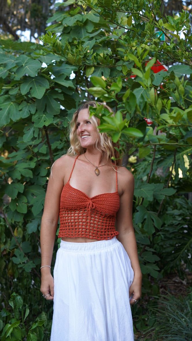 Introducing our new fave: the Bali crochet top! Handmade with bohemian flair, this casual top is perfect for everyday wear. Perfect for those who don't take themselves too seriously. Handcrafted with love by us! Details: * Sleeveless ; Back Cross Tie * One Size Fits All * Organic Cotton WASHING TIPS* Hand wash or gentle machine wash* No tumble drying* Cold Water Wash* Dry the flat cloth, try not hang it.Custom Orders of desired color, size or shapes are available with an extra 2-3 week shipping Crochet Crop Top For Beach, Crochet Crop Top For The Beach, Knit Crochet Trim Crop Top For Beach, Spring Bohemian Knit Top For Vacation, Bohemian Knit Top For Spring Vacation, Open Knit Top For Beach Season, Bohemian Spring Vacation Knit Top, Bohemian Crochet Knit Top With Crochet Trim, Bohemian Crochet Open Knit Top