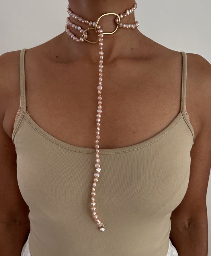 ** Pearl Necklace loops through Ring and can be wrapped once or multiple times. PEARLS are symbolic of wisdom gained through experience. The gems are believed to offer protection, as well as attract good luck and wealth. They are well-known for their calming effects. Pearls have a way of bringing balance to your karma, bring illumination, enlightenment, and insights on a mental level. Pearls symbolize purity and is known as a “stone of sincerity”. It brings truth to situations and loyalty to a “ Adjustable Long Wire Wrapped Necklace, Elegant Wire Wrapped Lariat Jewelry, Elegant Natural Stones Jewelry For Meditation, Elegant Natural Stone Jewelry For Meditation, Spiritual Long Gemstone Necklace, Adjustable Gemstone Amulet Jewelry, Bohemian Pearl Chain For Jewelry Making, Adjustable Infinity Fine Jewelry, Elegant Wire Wrapped Necklaces