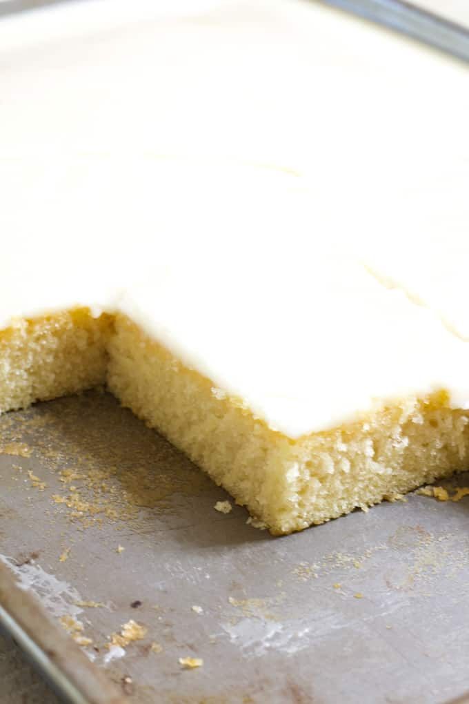 a piece of cake that has been cut in half on a baking sheet with a spatula