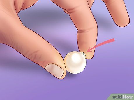 4 Ways to Tell if a Pearl Is Real - wikiHow Diy Pearl Jewelry, Pearls Jewelry Diy, Antique Pearl Necklace, Vintage Pearl Jewelry, Modern Pearl Earrings, Modern Pearl Jewelry, Diy Pearl Necklace, Handmade Pearl Jewelry, Jewelry Facts