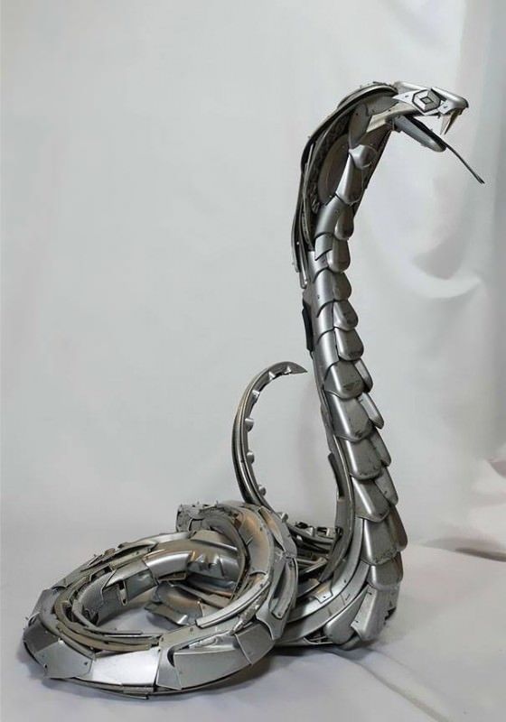 two metal sculptures sitting on top of each other