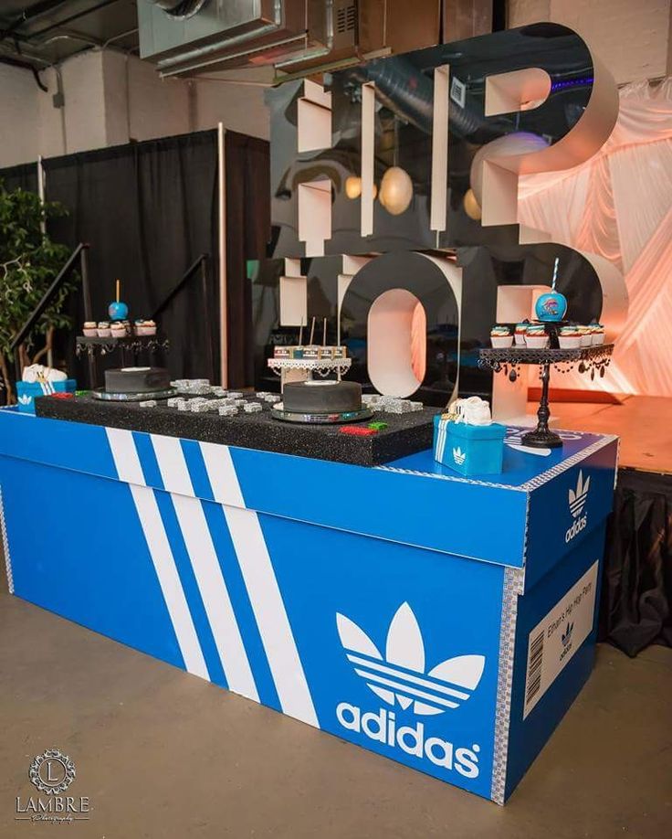 an adidas booth with dj equipment on display