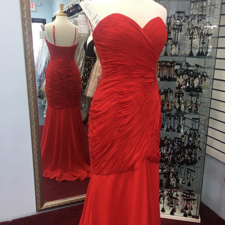 Red Dress Fit And Flair Elegant Red Ruched Gown, Red Dress With Ruched Bodice For Gala, Red Gala Dress With Ruched Bodice, Red Ruched Evening Dress For Prom, Elegant Red Sleeveless Gown, Red Evening Dress With Ruched Bodice For Prom, Fitted Red Maxi Dress With Ruched Bodice, Red Pleated Bodice Evening Dress, Elegant Red Dress With Pleated Bodice