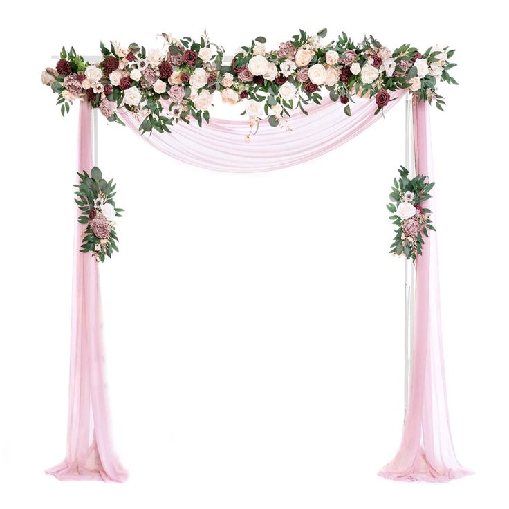 a wedding arch decorated with flowers and greenery on top of pink draping