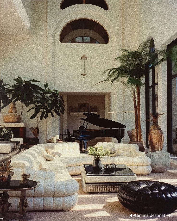 a living room filled with furniture and a grand piano