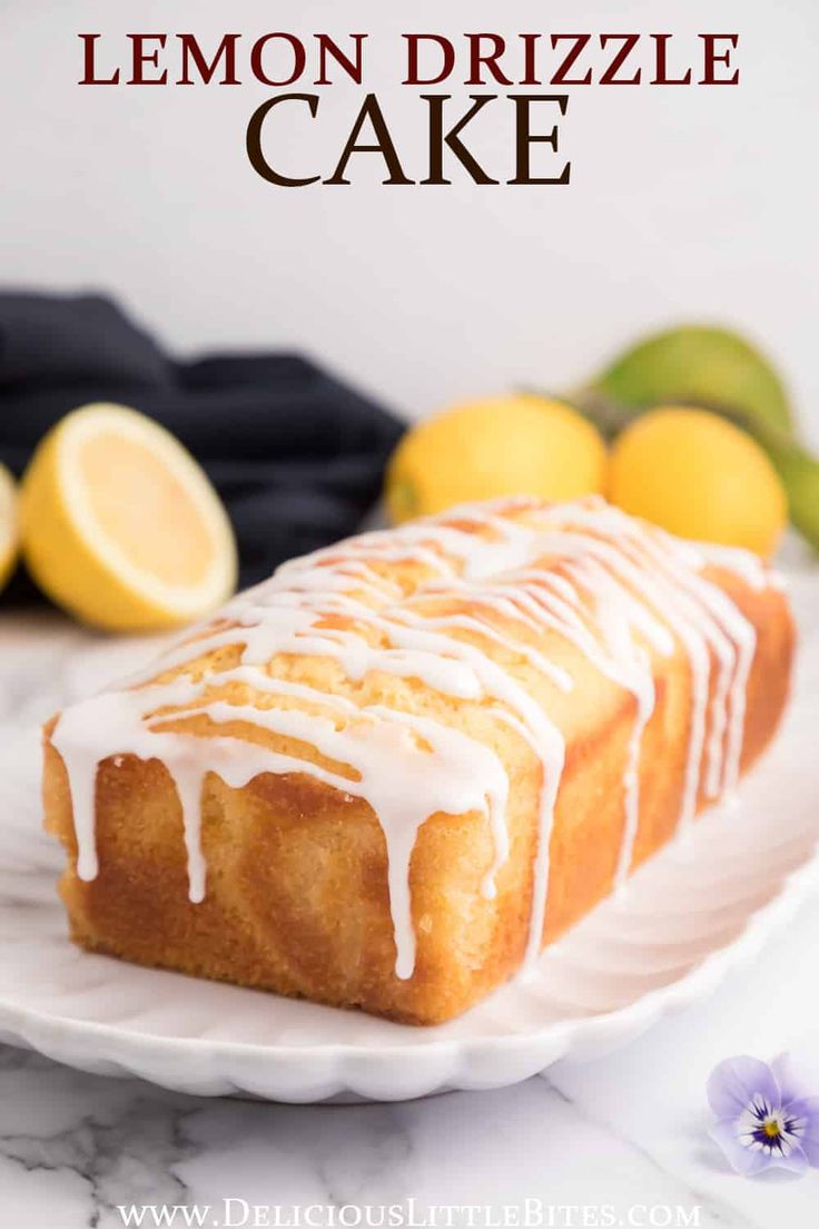 a lemon drizzle cake on a white plate