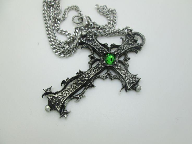 This Gothic cross necklace is an handmade pewter sculpture orned with an Austrian Swarovski or a real gem (My fav is the Black star Diopside, seriously) This gothic necklace is sold with a stainless steel chain of 18'' or 24'', if you would like to have a different length for the chain, you can write the desired length in the private note section when ordering :) This is a Gothic cross of 7cm This gothic cross necklace is a pewter sculpture of my own creation, i create and work the metal by myse Cross-shaped Halloween Jewelry Gift, Gothic Cross Necklace With Oxidized Finish, Gothic Oxidized Cross Necklace, Gothic Cross Pendant Jewelry For Halloween, Gothic Ankh Jewelry For Gift, Handmade Gothic Cross Jewelry, Gothic Metal Cross Jewelry, Gothic Cross Metal Jewelry, Medieval Engraved Cross Jewelry