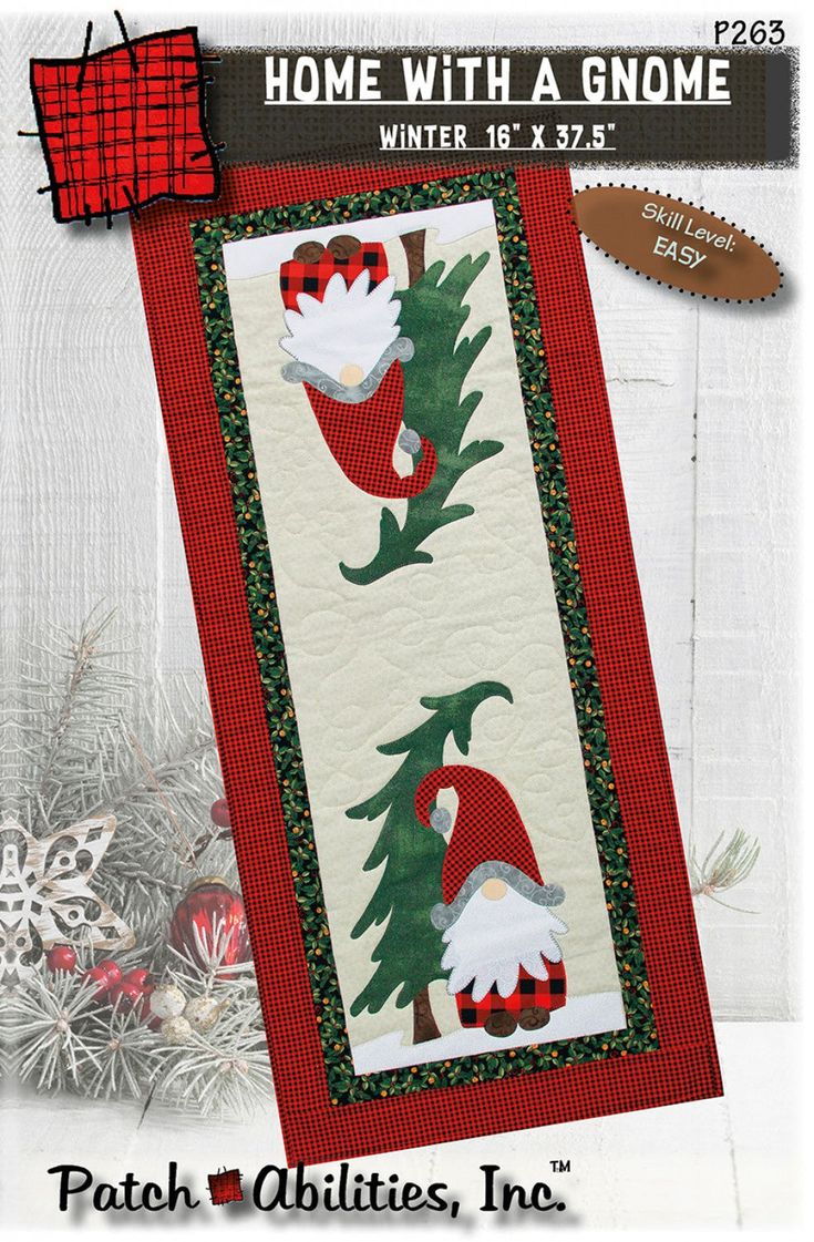 a christmas quilt with gnomes on it and snowflakes around the tree in the background