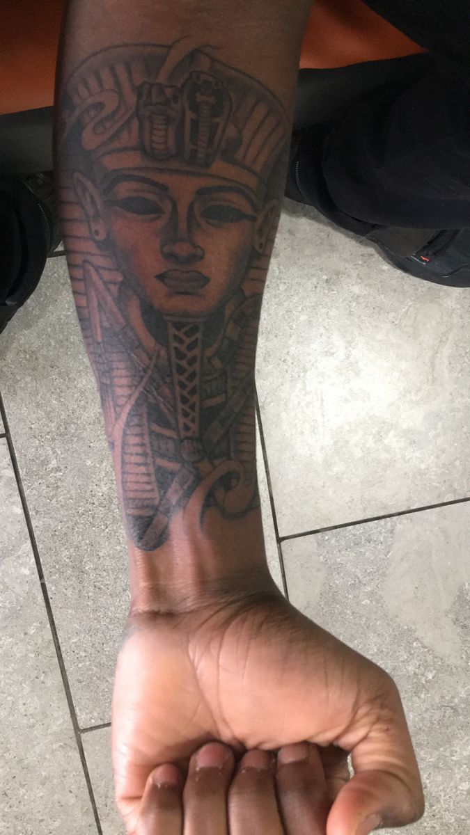 a person with a tattoo on their arm