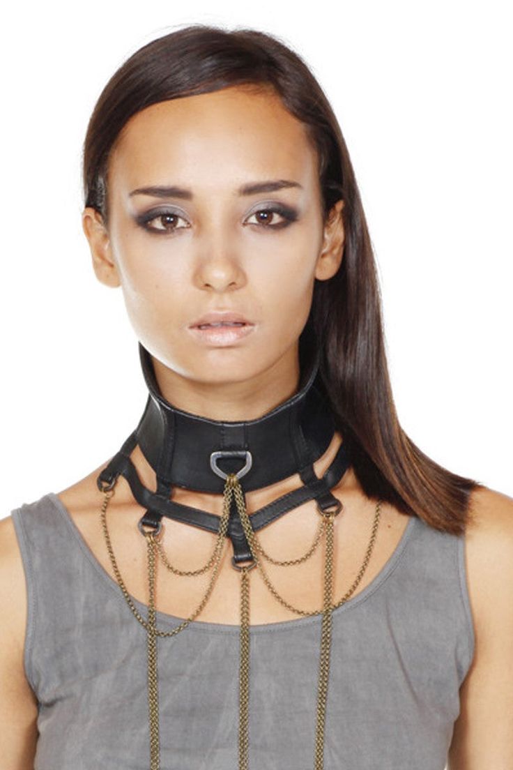 This collar is so sexy that I hesitate to call it an accessory; it's an entire outfit. Made from the absolute softest lambskin, it's meant to be worn high on the neck, fanning out along collar bone into a web. Intricate chains drape from a circle of D rings while an adjustable snap closure fits most. Looks perfect layered over any outfit - or nothing at all. 100% leather with brass details Custom Made Snap Closure Designed by Jan Hilmer Made in Small Batches Sizing:S/M: fits up to 13.5"M/L: 13.5 Alt Indie, Inclusive Fashion, Nothing At All, Collar Bone, Alt Fashion, Steam Punk, A Circle, Indie Design, Dark Fashion