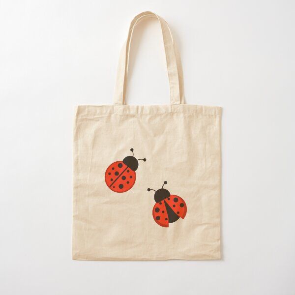 a tote bag with two ladybugs on it