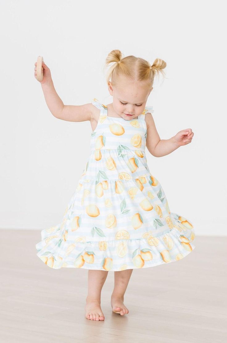 Our Maxi Dress is perfect for summer! Back has a cute cutout and straps are finished off with a sweet ruffle on the shoulder. Also available in a matching baby romper! Perfect for family matching. Super soft fabric stays bright wash after wash. INSTRUCTIONS: Wear-Twirl-Repeat FIT & FABRIC & CARE: True to Size Polyester/Spandex Machine Wash/Tumble Dry Low Playful Ruffled Twirl Dress For Summer, Cute Tiered Ruffle Sundress, Cute Tiered Ruffled Sundress, Casual Ruffled Twirl Dress For Spring, Casual Summer Twirl Dress For Playwear, Playful Cotton Twirl Dress For Spring, Cute Spring Twirl Dress For Playwear, Spring Flutter Sleeve Twirl Dress For Playdate, Cute Tiered Sundress With Ruffle Hem