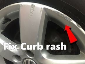 the front wheel of a silver car with an arrow pointing to fix curbash on it