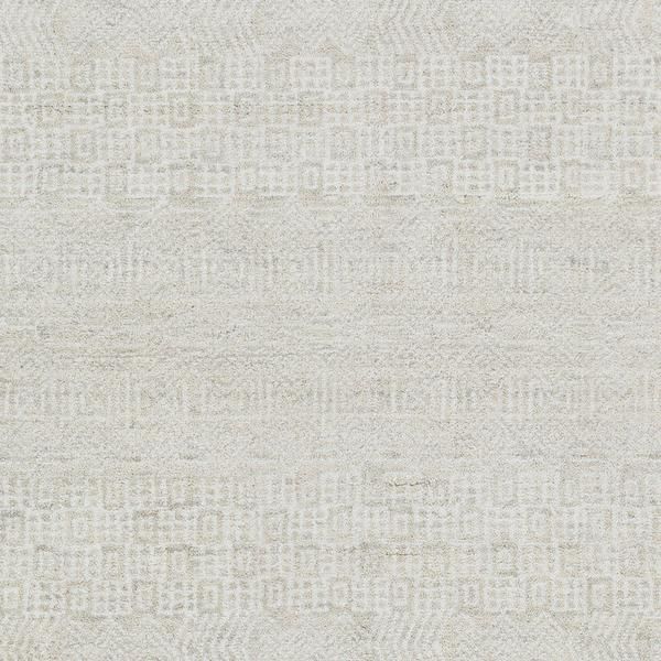 a white rug with an abstract design on the front and back side, in shades of beige