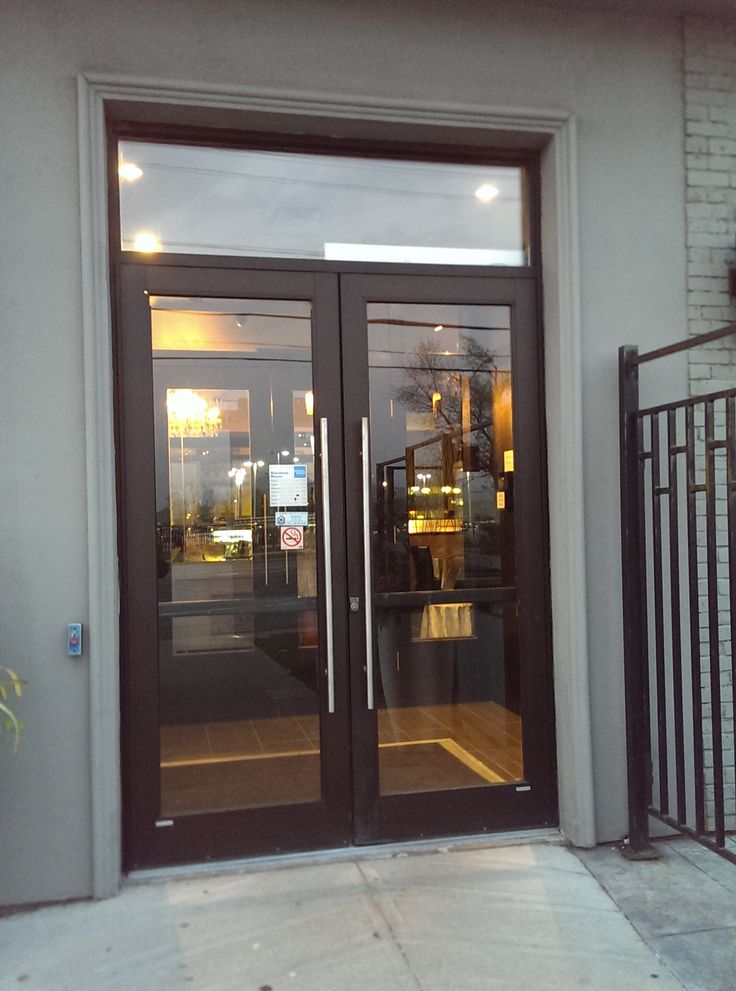 an entrance to a restaurant with double doors